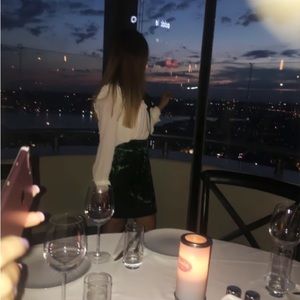 Green velvet skirt of brand Sandro